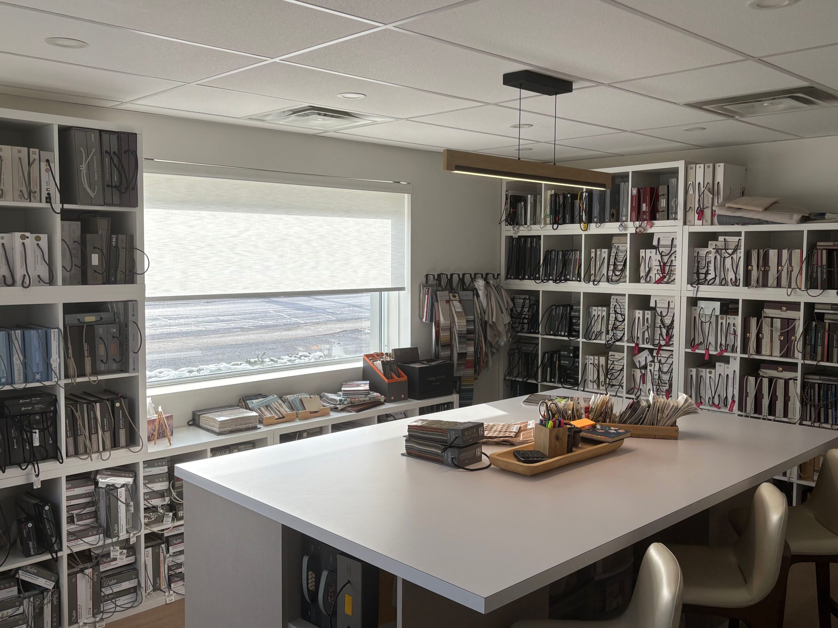 Modern kitchen with white island and ample storage space.